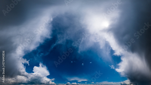 Fototapeta Naklejka Na Ścianę i Meble -  Blue fantastic sky with clouds and sunshine (wide natural cloudscape background panorama)