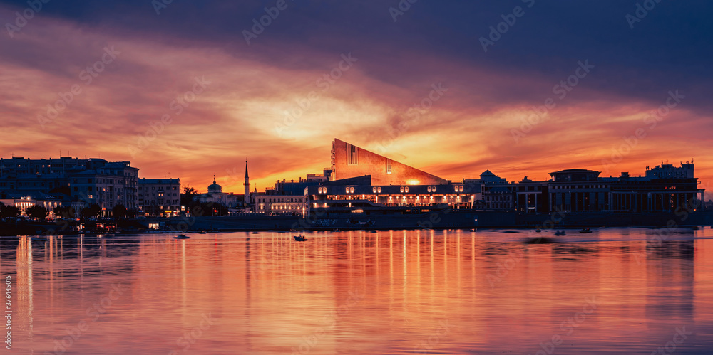 Kaban lake in front of Kamal Theatre in Kazan. Popular attraction of the city. Sunset cityscape.