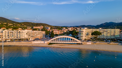 Aerial view of Sainte-Maxime seafront and its famous bridge in French Riviera (South of France)