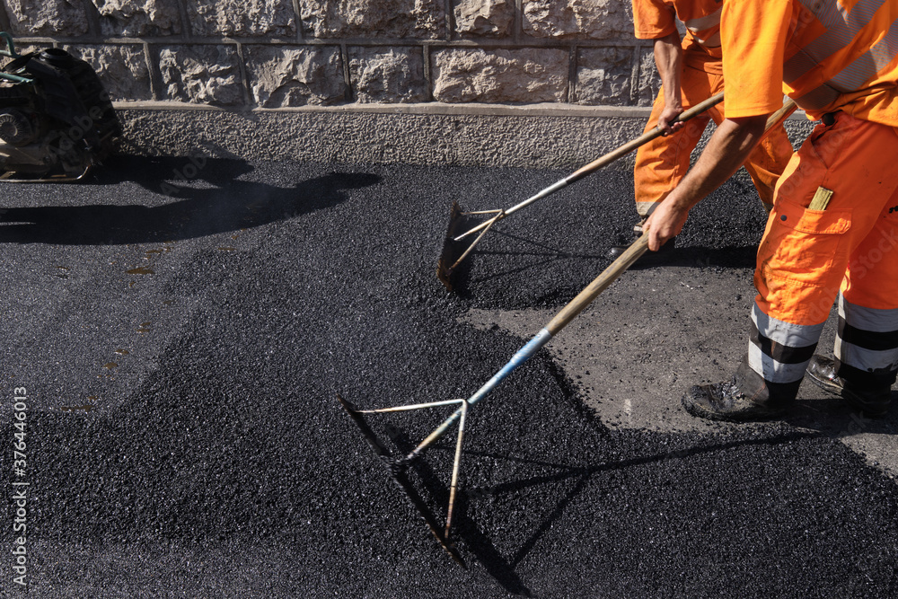 Paving the road with porous asphalt for traffic noise.reduction in Geneva, switzerland Paving the road with porous asphalt for traffic noise.reduction in Geneva, switzerland