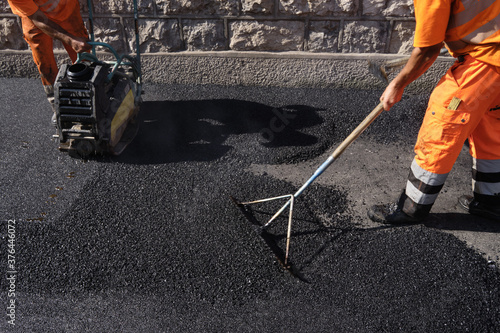 Paving the road with porous asphalt for traffic noise.reduction in Geneva, switzerland photo