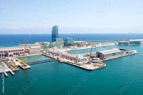 Panorama, urban cityscape of Barcelona, Spain, and the coastline of Mediterranean sea taken from the cable car of the teleferic road leading from Barcelona port to Montjuic hill 