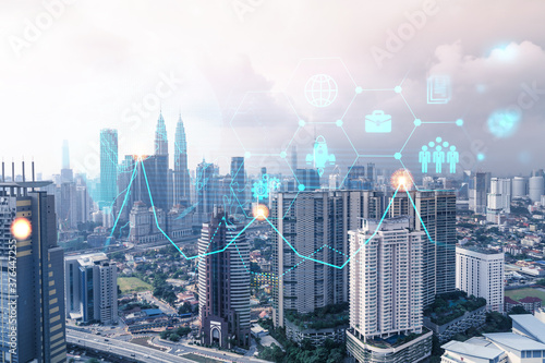Research and development hologram over panorama city view of Kuala Lumpur. KL is hub of new technologies to optimize business in Malaysia  Asia. Concept of exceeding opportunities. Double exposure.