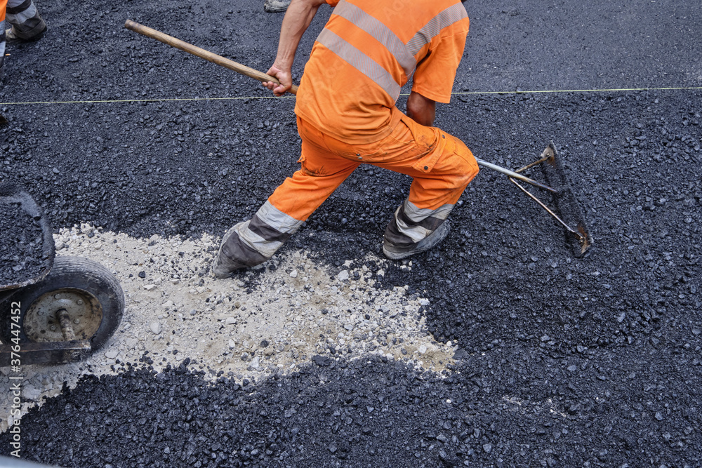 Paving the road with porous asphalt for traffic noise.reduction in Geneva, switzerland