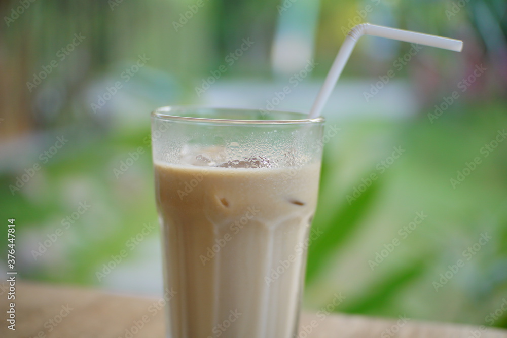 Close up of ice coffee milk on a cafe table. Close up of ice coffee milk on a cafe table.