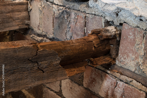 Schilderij op canvas Rotton broken floor joists exposed during home renovation and building works