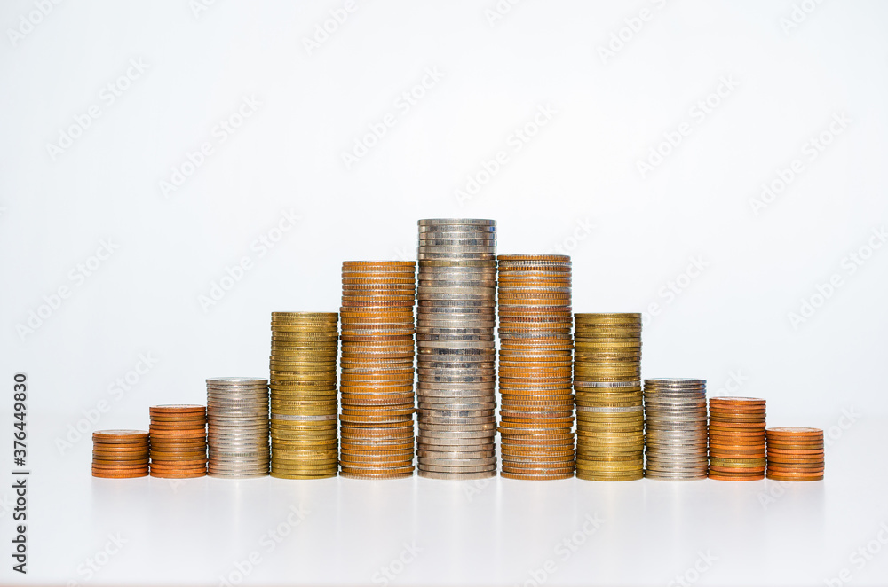 copper silver and golden coin many rate stack row growing pile on white background for money saving and investment business financial and banking concept. copper silver and golden coin many rate stack row growing pile on white background for money saving and investment business financial and banking concept.