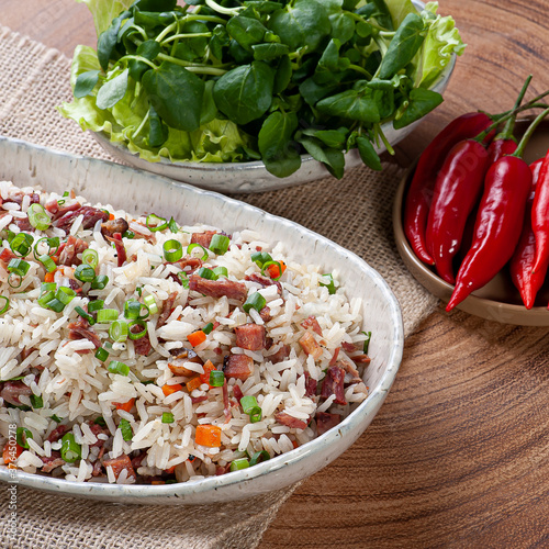 Arroz de Carreteiro - Typical food from southern Brazil, made with rice, dried meat, pepperoni sausage, bacon and carrots. photo