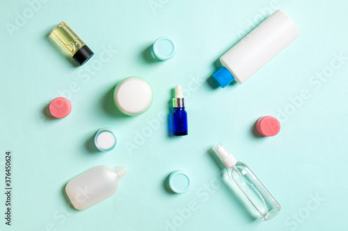 Group of plastic bodycare bottle Flat lay composition with cosmetic products on colored background empty space for you design. Set of White Cosmetic containers, top view with copy space