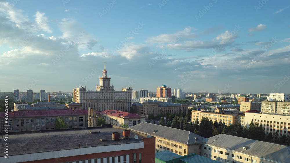 Obraz premium Chelyabinsk cityscape at summer time with a view to South Ural State University and soviete buildings roofs and blue sky with clouds