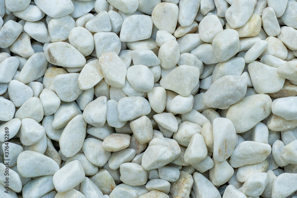 Background from many white stones, pebbles close up Background from many white stones, pebbles close up