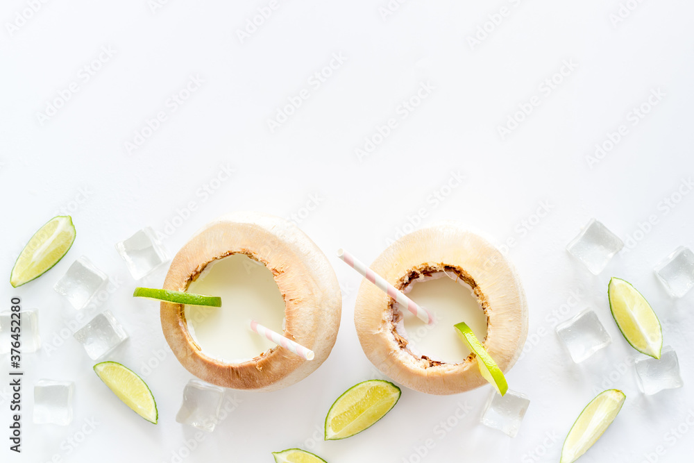 Diet drink - coconut milk with srtaw top view Diet drink - coconut milk with srtaw top view