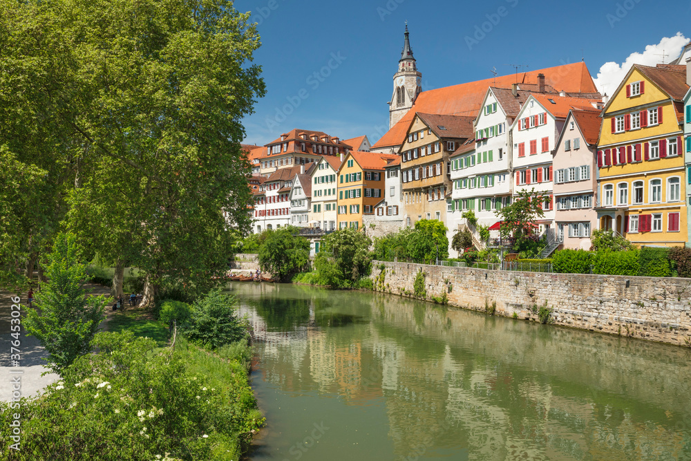 Old town with Stiftskirche church reflecting in Neckar river, Tubingen, Baden-Wurttemberg Old town with Stiftskirche church reflecting in Neckar river, Tubingen, Baden-Wurttemberg