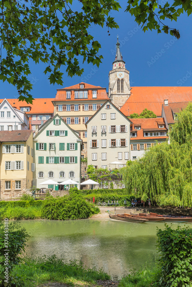 Old town with Stiftskirche church reflecting in Neckar river, Tubingen, Baden-Wurttemberg Old town with Stiftskirche church reflecting in Neckar river, Tubingen, Baden-Wurttemberg