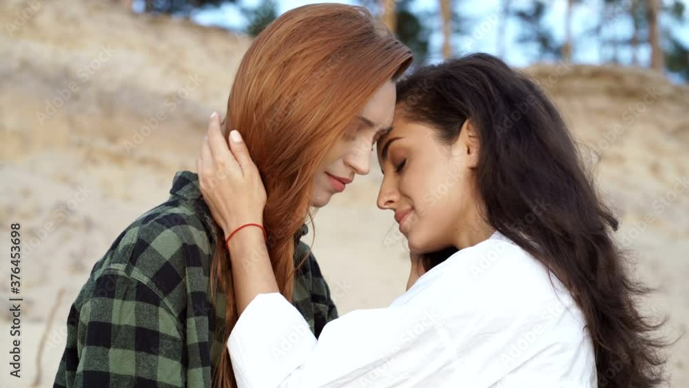Portrait of romantic women couple outdoors. Portrait of romantic women couple outdoors.