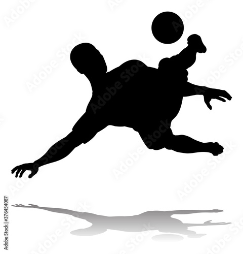 A soccer or football player in silhouette
