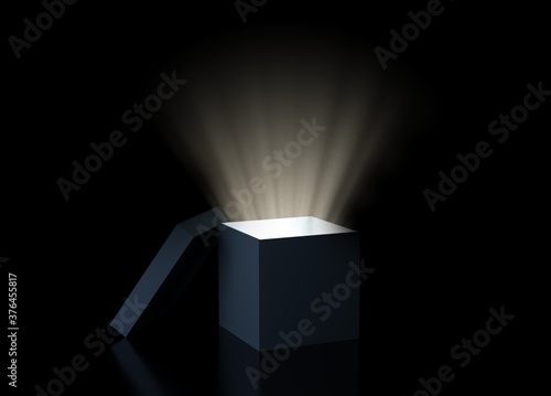 Magic box with glowing light over black background, exploration, idea or discovery concept