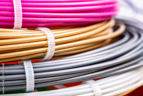 Obraz na plátně Closeup view of rolled wires for filament plastic for 3D printing pen