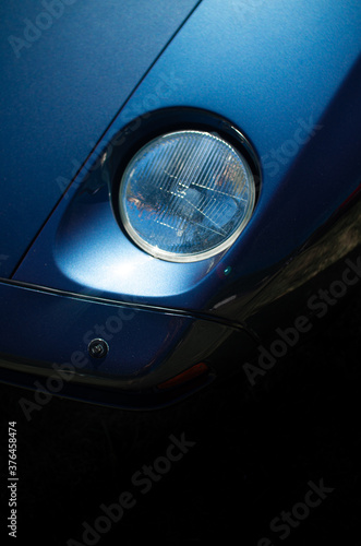 Headlight of a newtimer car detail photo