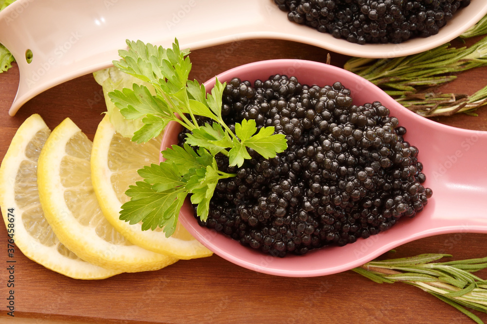 Black caviar with fresh herbs Black caviar with fresh herbs