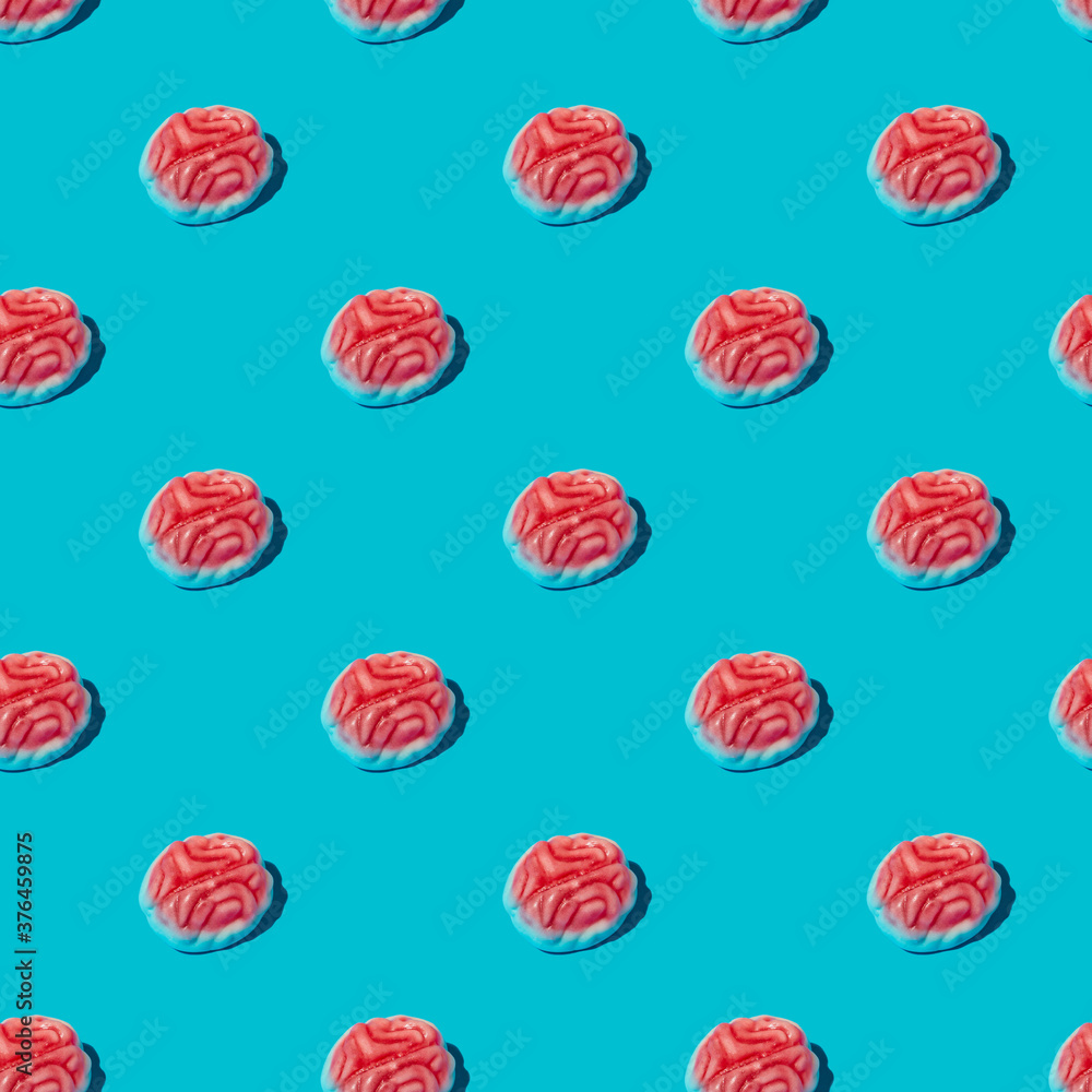 Seamless pattern from brains with shadow. Halloween background made of repeating sweets in a brain shape. Seamless pattern from brains with shadow. Halloween background made of repeating sweets in a brain shape.
