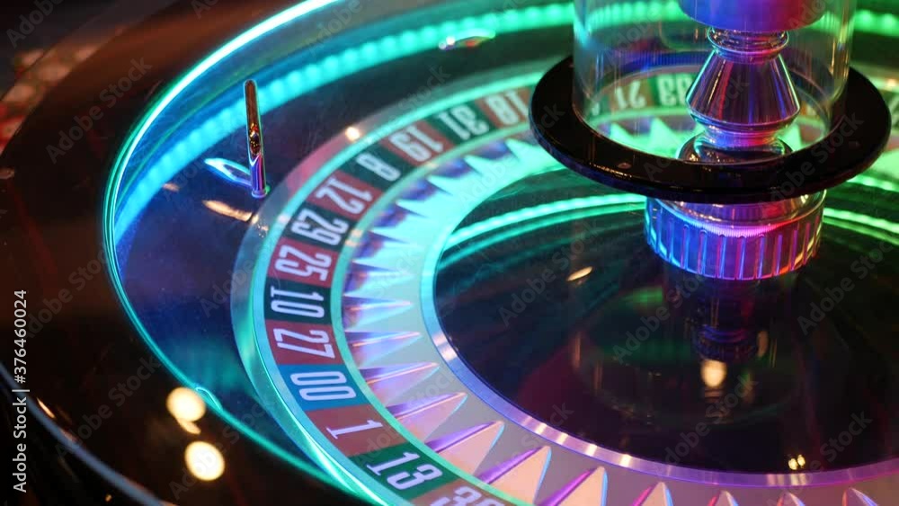 French style roulette table for money playing in Las Vegas, USA. Spinning wheel with black and red sectors for risk game of chance. Hazard amusement with random algorithm, gambling and betting symbol. French style roulette table for money playing in Las Vegas, USA. Spinning wheel with black and red sectors for risk game of chance. Hazard amusement with random algorithm, gambling and betting symbol.