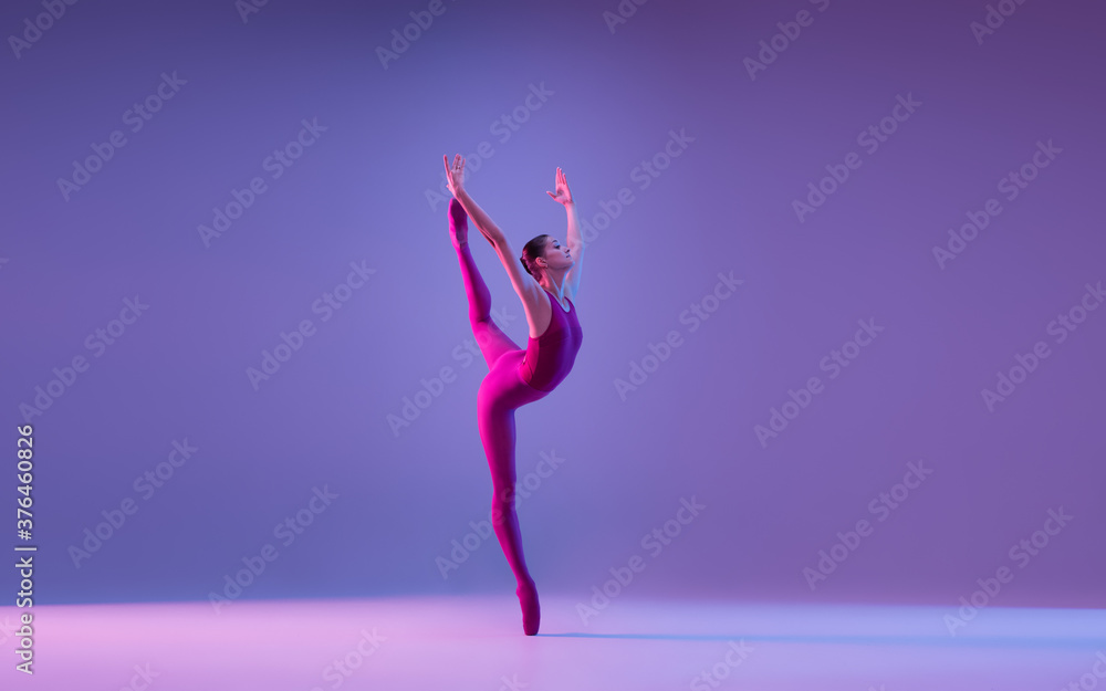 © master1305 - Freedom. Young and graceful ballet dancer isolated on purple studio background in neon light. Art, motion, action, flexibility, inspiration concept. Flexible caucasian ballet dancer, weightless jumps. © master1305 - Freedom. Young and graceful ballet dancer isolated on purple studio background in neon light. Art, motion, action, flexibility, inspiration concept. Flexible caucasian ballet dancer, weightless jumps.