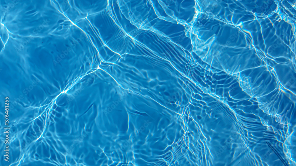 The water in the pool is blue, penetrated by the rays of the sun. Selective focus. Healthy lifestyle. Vacation for children. The water in the pool is blue, penetrated by the rays of the sun. Selective focus. Healthy lifestyle. Vacation for children.