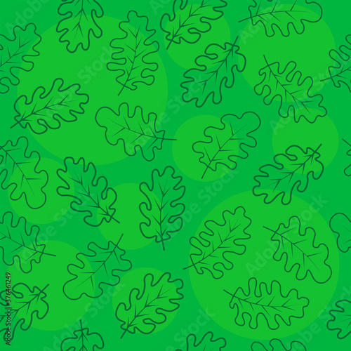 Seamless pattern of oak leaves on a green background