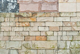 Texture of brick wall. new brickwork. Samples of wall or fence are presented at exhibitions. Yellow brick close up.