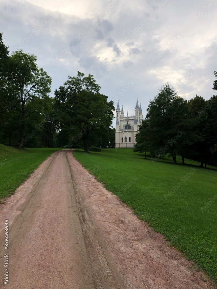 Beautiful white Gothic chapel and road view Beautiful white Gothic chapel and road view