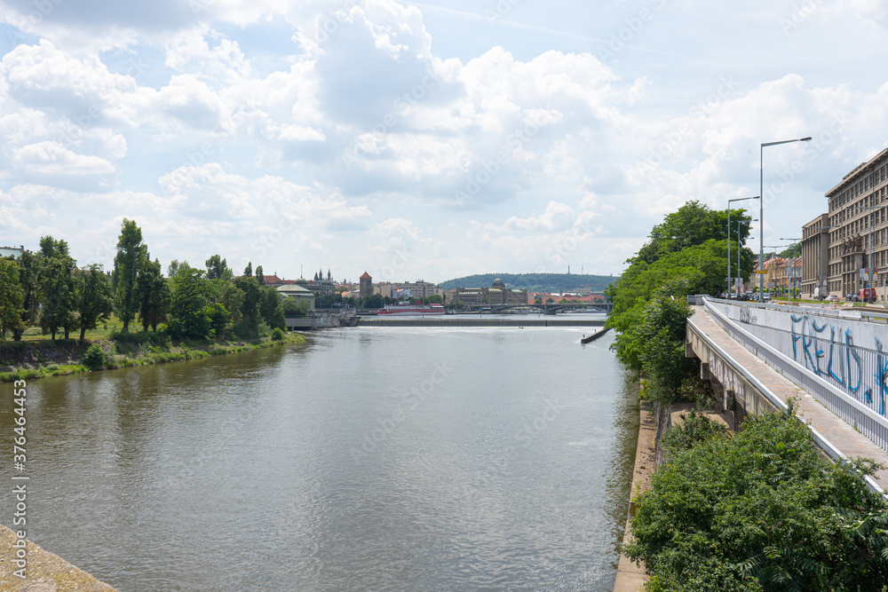 
view of the flowing Vltava river in the center of Prague during the day