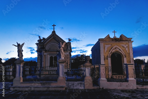 Graveyard tombs with corsses and angel statues at the cemetery 'Cementerio General' in Merida, Yucatan, Mexico photo