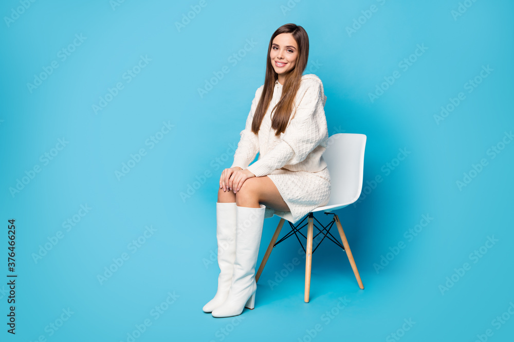Full length photo of charming nice girl sitting chair wait for her job interview wear white trend clothes isolated over blue color background Full length photo of charming nice girl sitting chair wait for her job interview wear white trend clothes isolated over blue color background