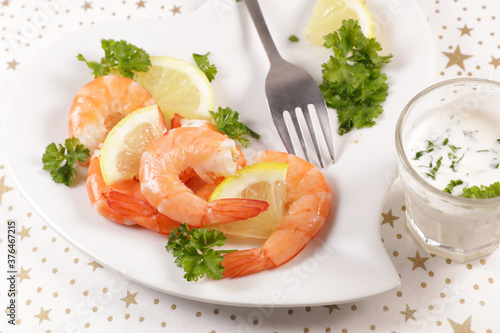 shrimp snack with fresh yogurt sauce and herbs