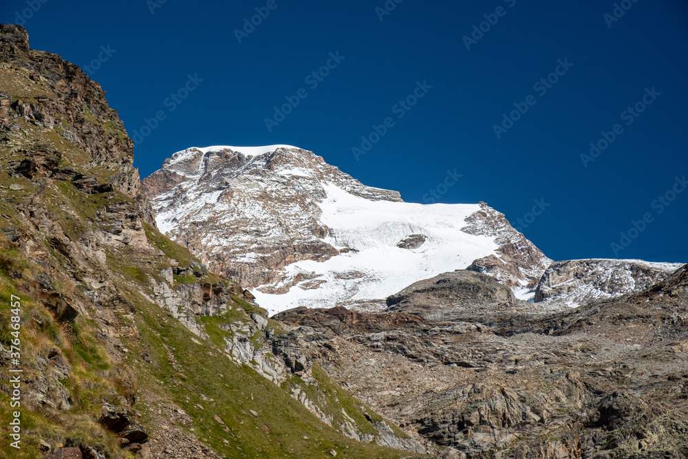 Panoramic view of an alpine landscape in the background the Vincent Pyramid at Monte Rosa.