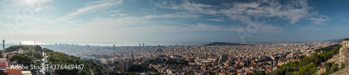 Wide panorama of Barcelona  Spain  viewed from the Bunkers of Carmel on a sunny day with blue skies. Picturesque panorama of morning Barcelona.