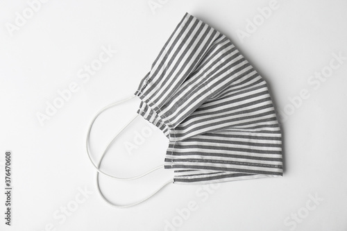 Homemade protective face mask on white background, top view