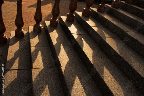 play of light and shadow on a stone staircase