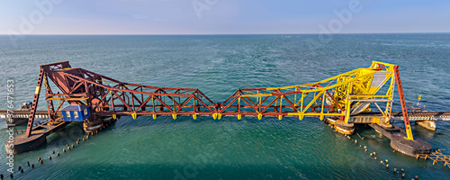 Pamban Bridge is a railway bridge which connects the town of Mandapam, India.