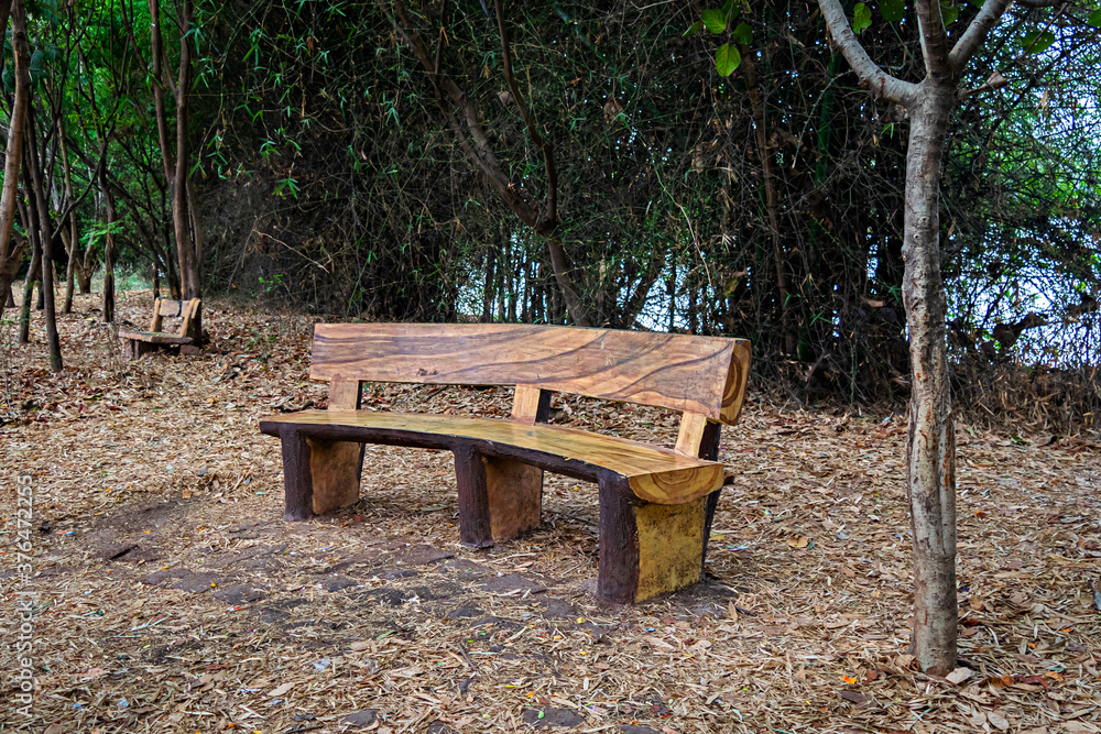Abstract , isolated image of curved wooden bench made of natural wood. Abstract , isolated image of curved wooden bench made of natural wood.