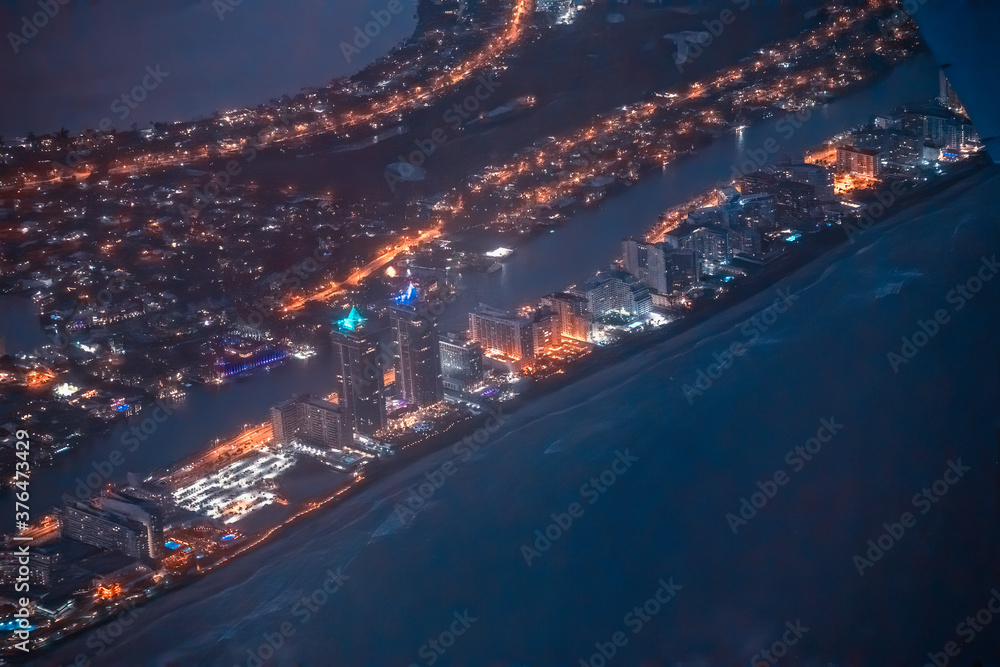 Night aerial view of Miami Beach skyline from the airplane Night aerial view of Miami Beach skyline from the airplane