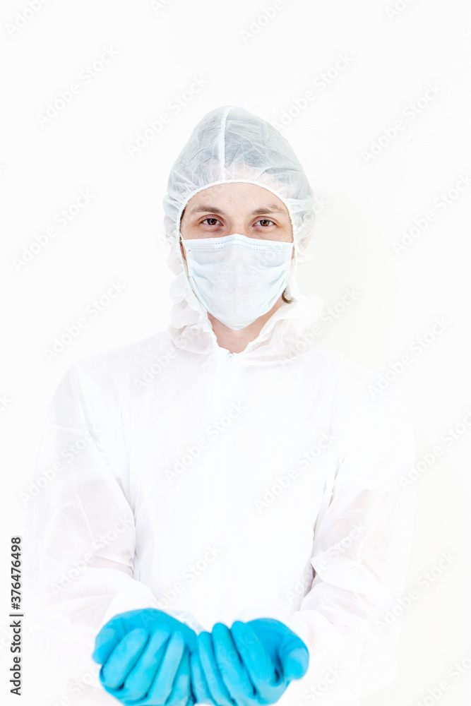 A man in a protective suit and face mask. Holds something like a bottle or jar isolated on a white background A man in a protective suit and face mask. Holds something like a bottle or jar isolated on a white background