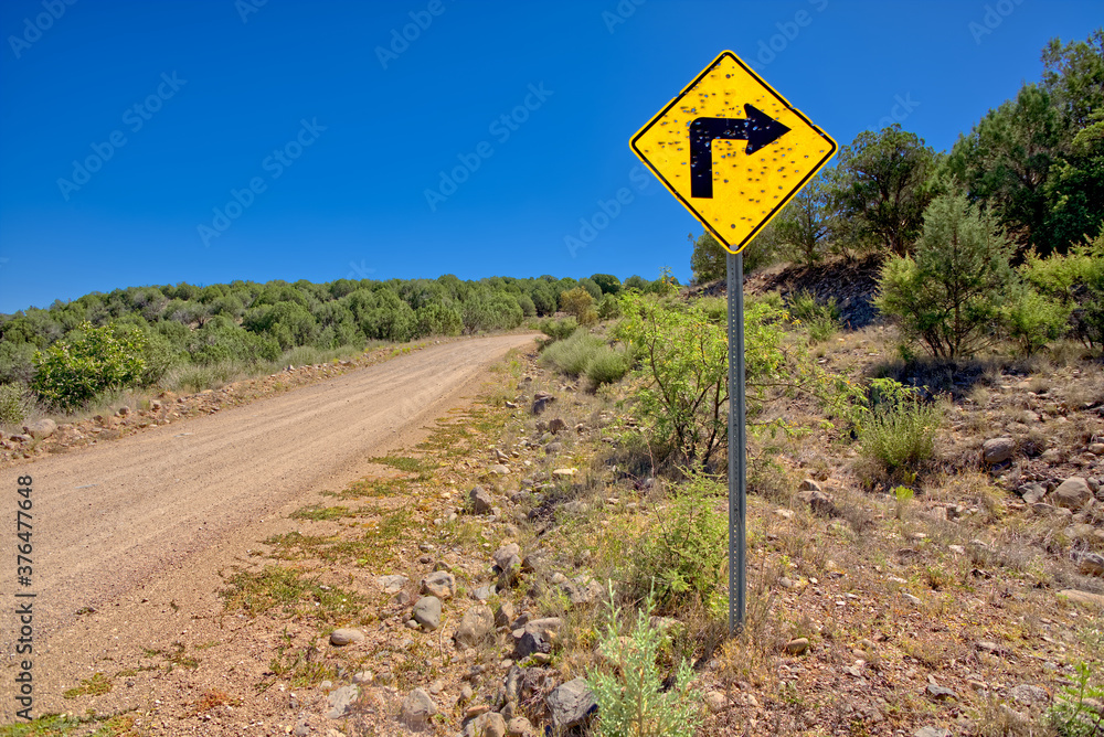 A sign along Forest Service Road 492 that has been shot up by reckless gunfire, Prescott National Forest, Arizona A sign along Forest Service Road 492 that has been shot up by reckless gunfire, Prescott National Forest, Arizona