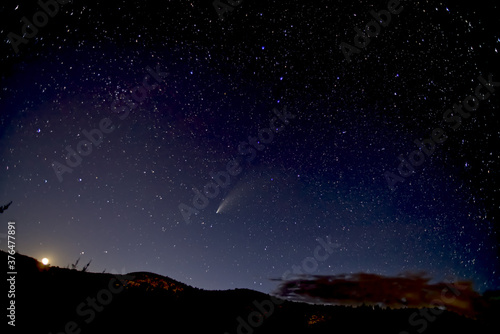 Comet NeoWise 2020 above Sullivan Butte in Chino Valley, with the Moon on the lower left and the Big Dipper in the center, Arizona
