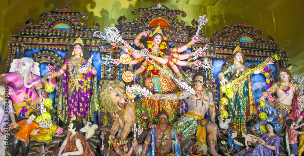 Durga Puja or Durgotsava,is an annual Hindu festival celebrated mainly in West Bengal,Indian.Durga is Goddess riding a lion with many arms each carrying weapon and defeating evil power of Mahishasura.