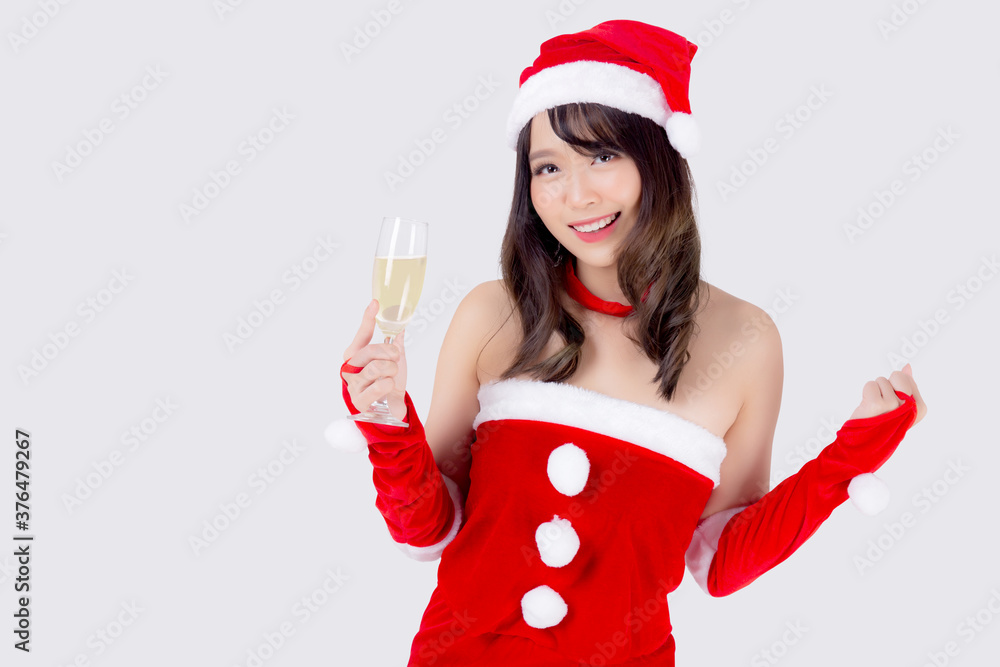 Beautiful portrait young asian woman in Santa holding glass of champagne with party celebrating in xmas holiday isolated on white background, asia girl drink beverage, Christmas and new year concept. Beautiful portrait young asian woman in Santa holding glass of champagne with party celebrating in xmas holiday isolated on white background, asia girl drink beverage, Christmas and new year concept.