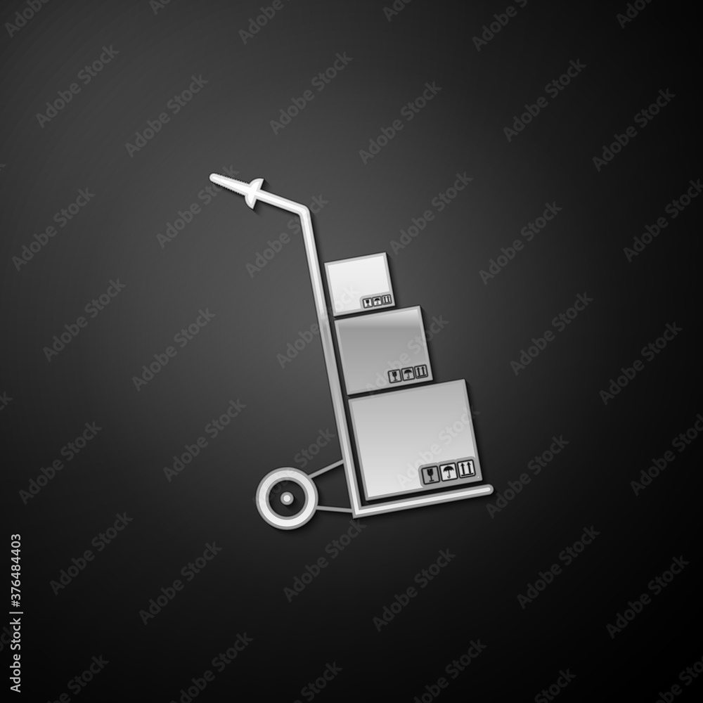 Silver Hand truck and boxes icon isolated on black background. Dolly symbol. Long shadow style. Vector. Silver Hand truck and boxes icon isolated on black background. Dolly symbol. Long shadow style. Vector.