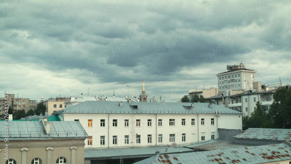 Aerial view of the city center departure from behind the building in cloudy weather Aerial view of the city center departure from behind the building in cloudy weather