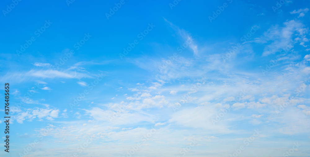 White clouds in the blue sky. Light heavenly background. Natural background. White clouds in the blue sky. Light heavenly background. Natural background.